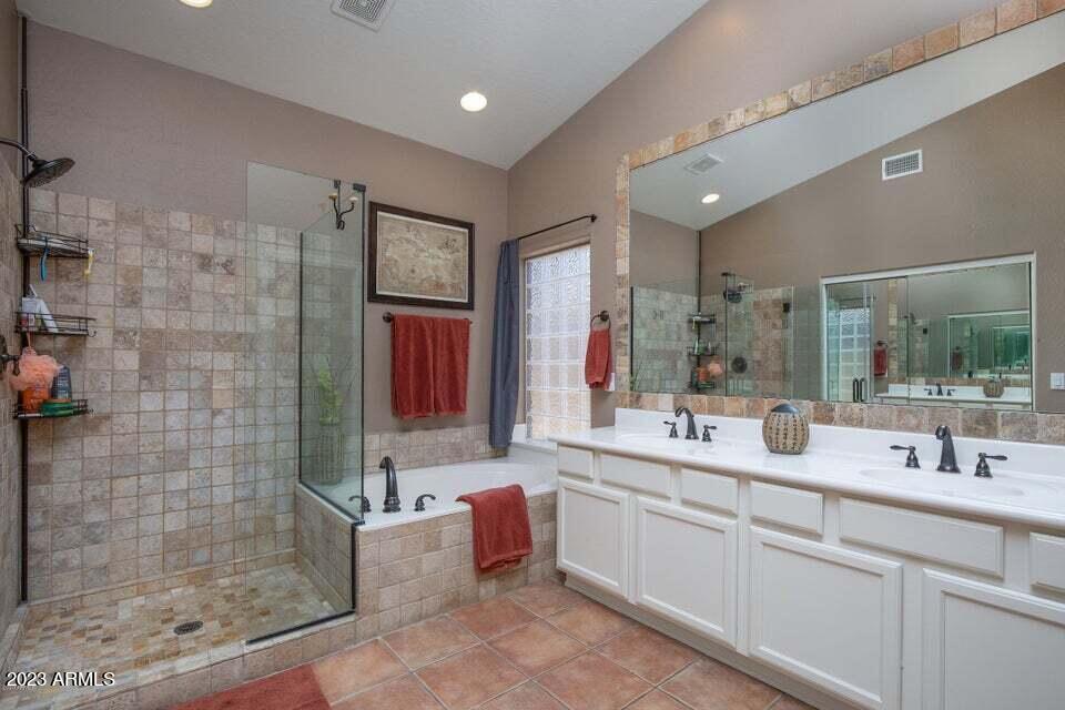 7338 East Wingspan Way Scottsdale, AZ 85255 - Photo 17 of 32 a bathroom with a double vanity sink mirror and shower