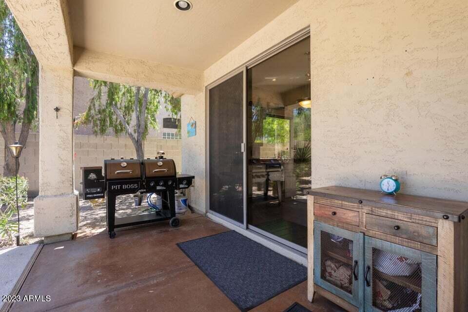 7338 East Wingspan Way Scottsdale, AZ 85255 - Photo 29 of 32 a dining room with furniture and a window