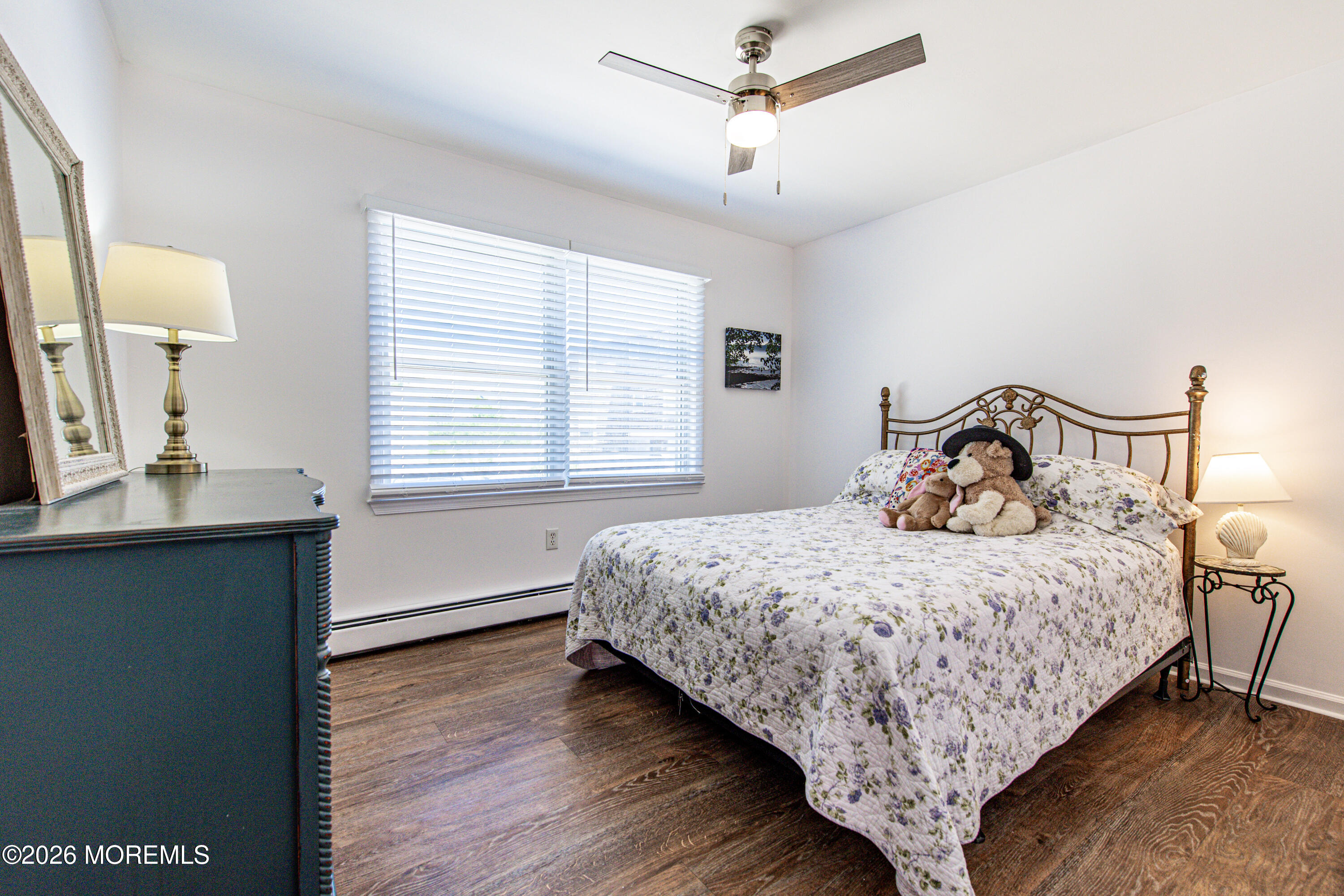 5 A Sunset Boulevard Barnegat Light, NJ 08006 - Photo 30 of 65 a bedroom with a bed and window