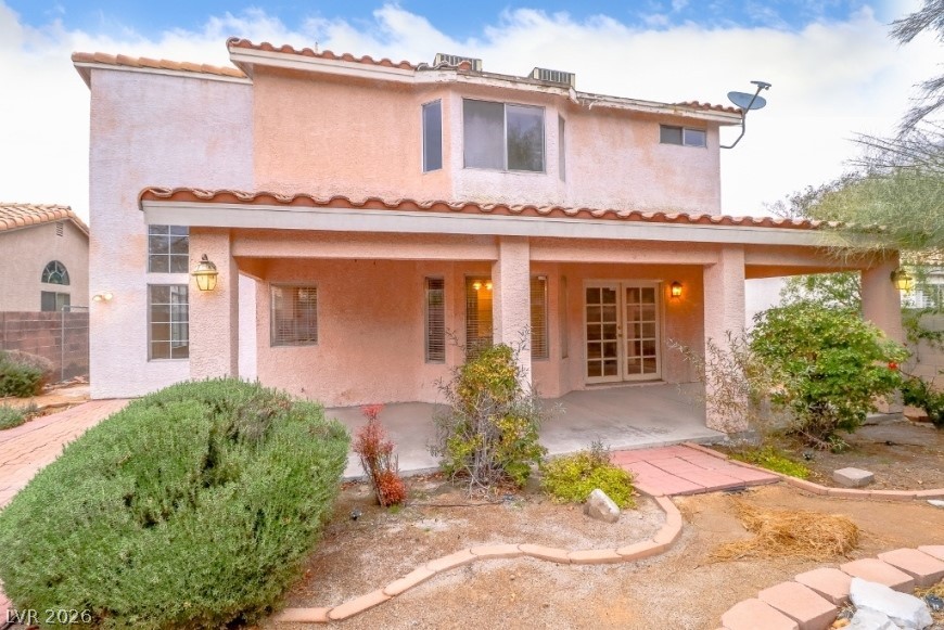 1429 Hawkwood Road Henderson, NV 89014 - Photo 38 of 53 A spacious covered patio anchors the backyard of this Spanish-style residence.