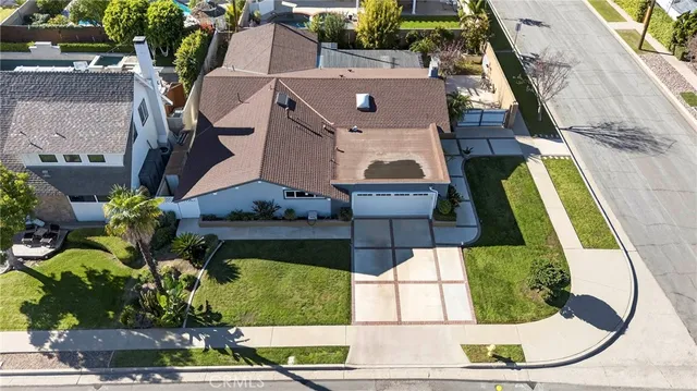 an aerial view of a house with a swimming pool