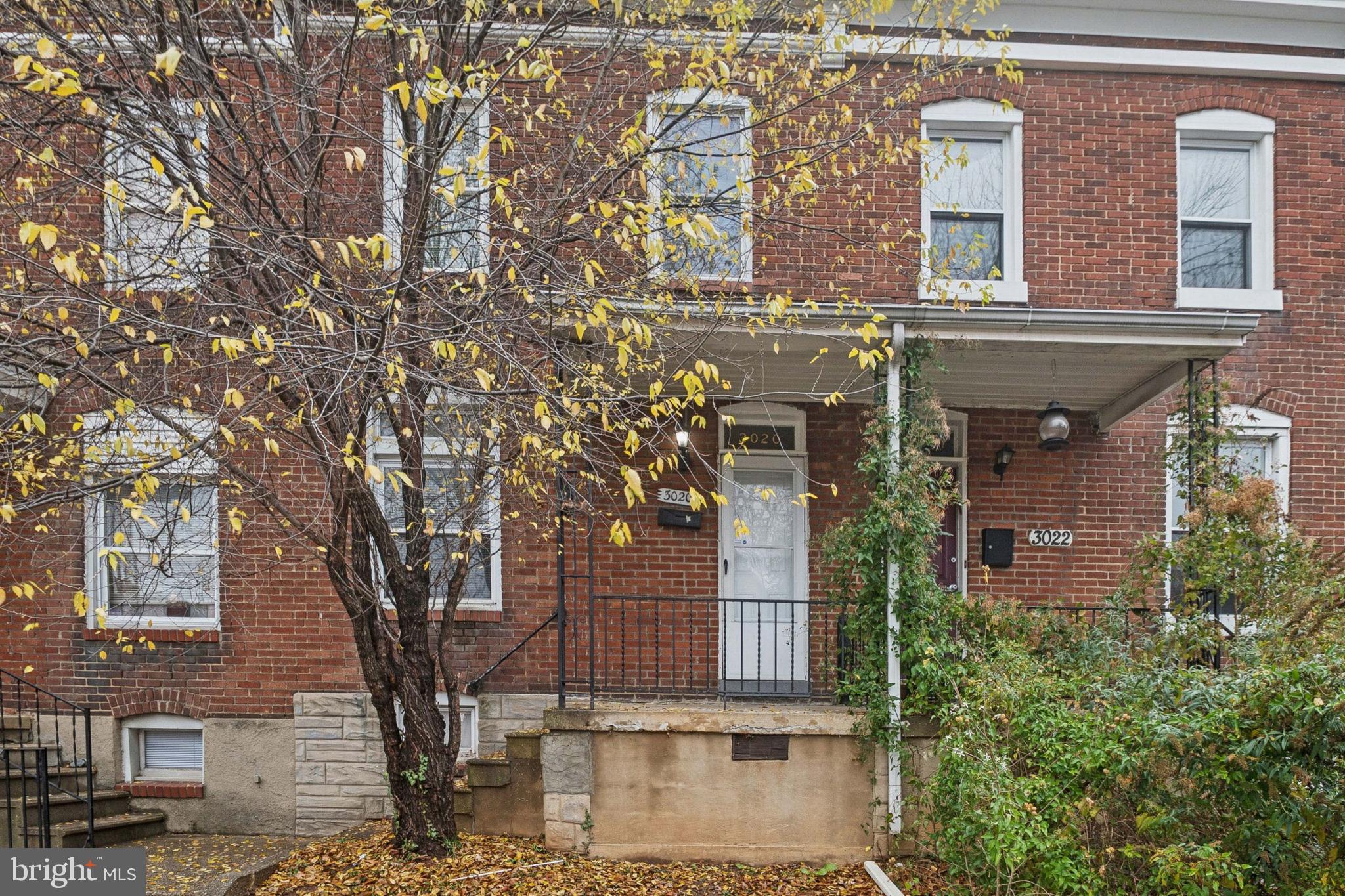 3020 Mathews Street Baltimore, MD 21218 - Photo 1 of 25 front view of a house with a tree