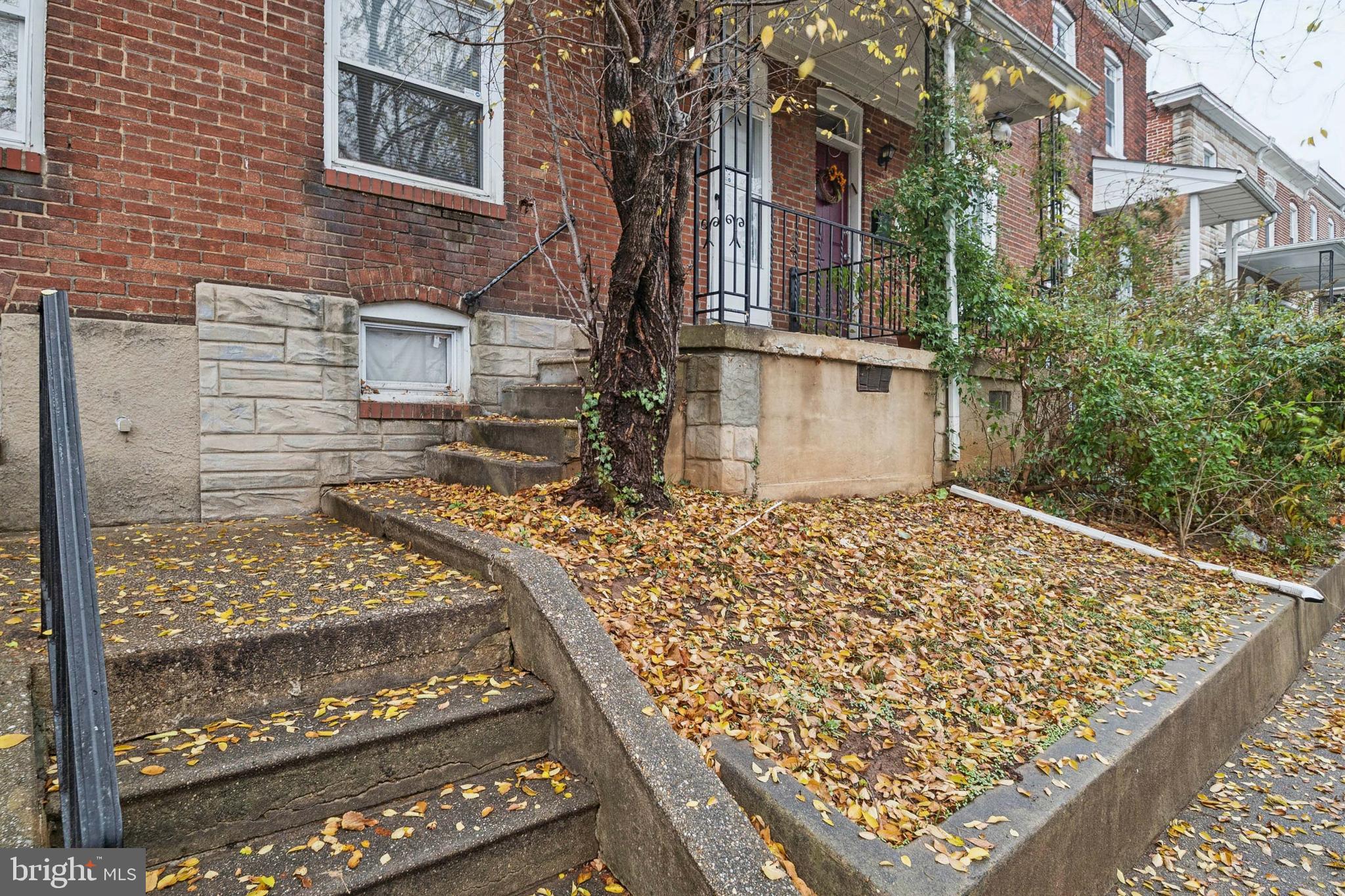3020 Mathews Street Baltimore, MD 21218 - Photo 2 of 25 front view of a house with a yard