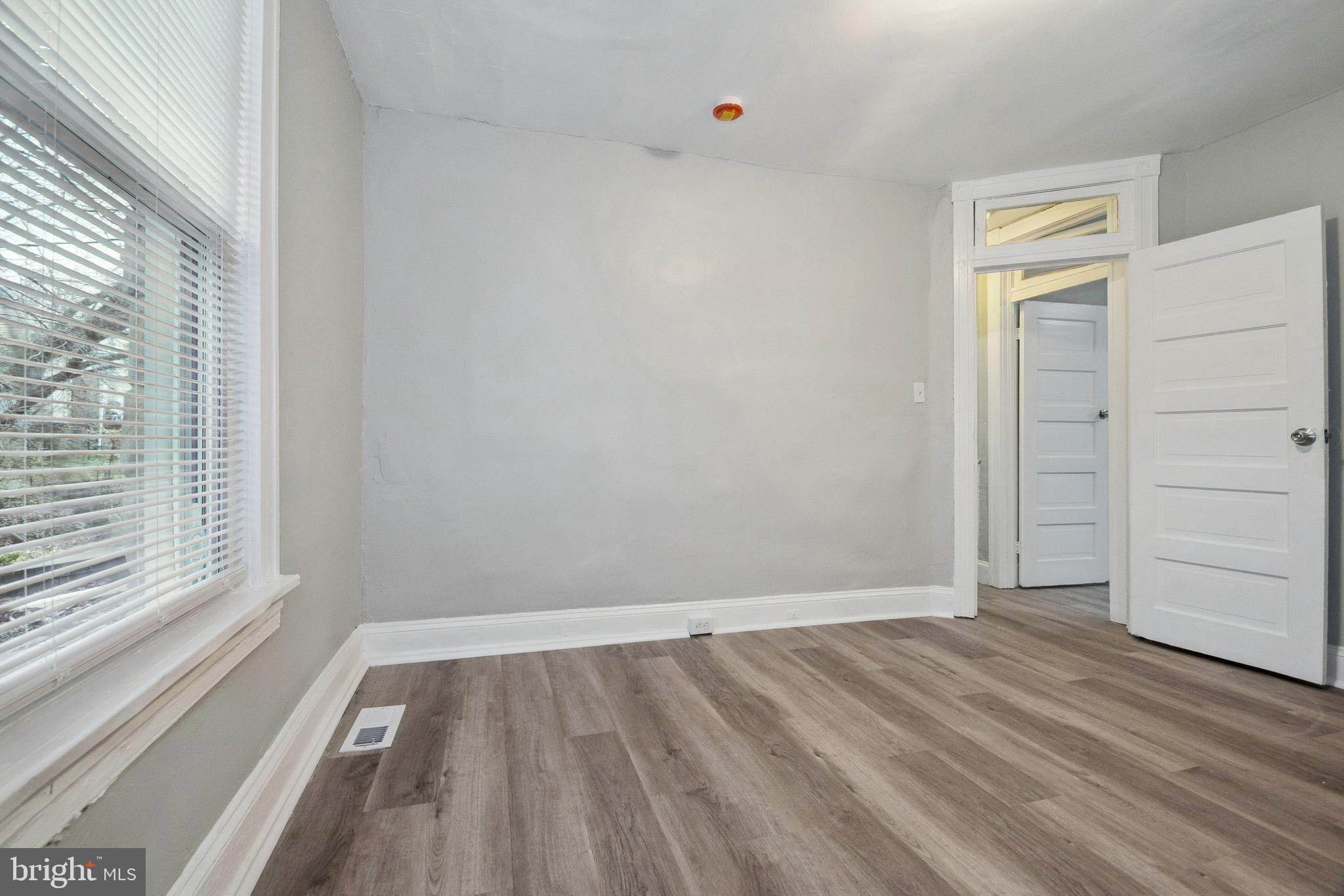 3020 Mathews Street Baltimore, MD 21218 - Photo 21 of 25 wooden floor in an empty room