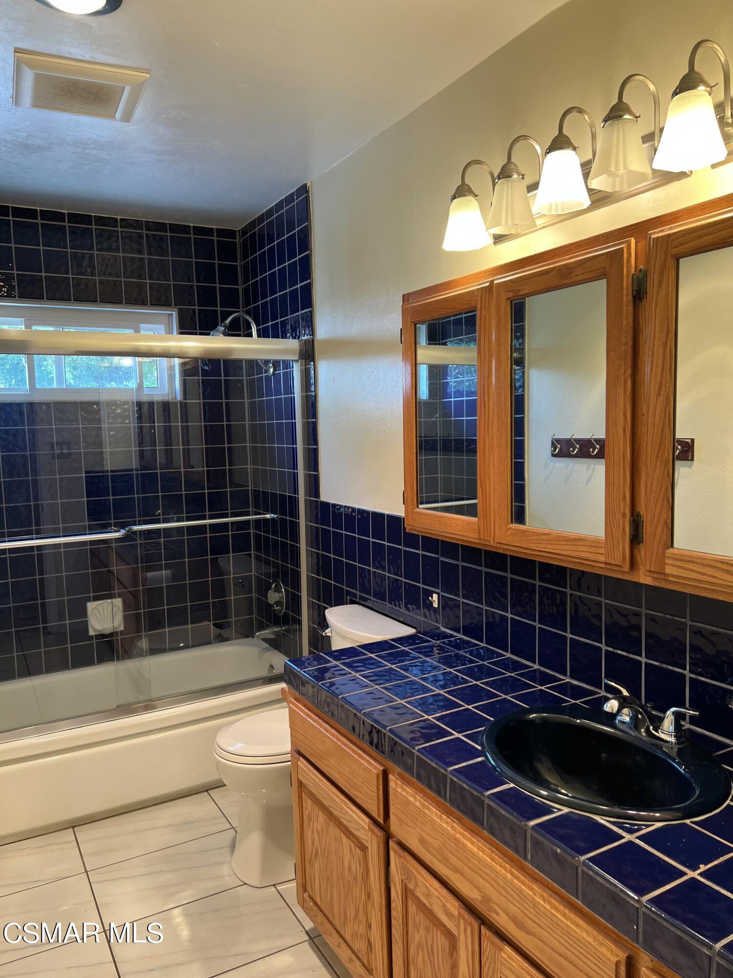 3546 Royal Avenue Simi Valley, CA 93063 - Photo 17 of 26 a bathroom with a bathtub and a shower