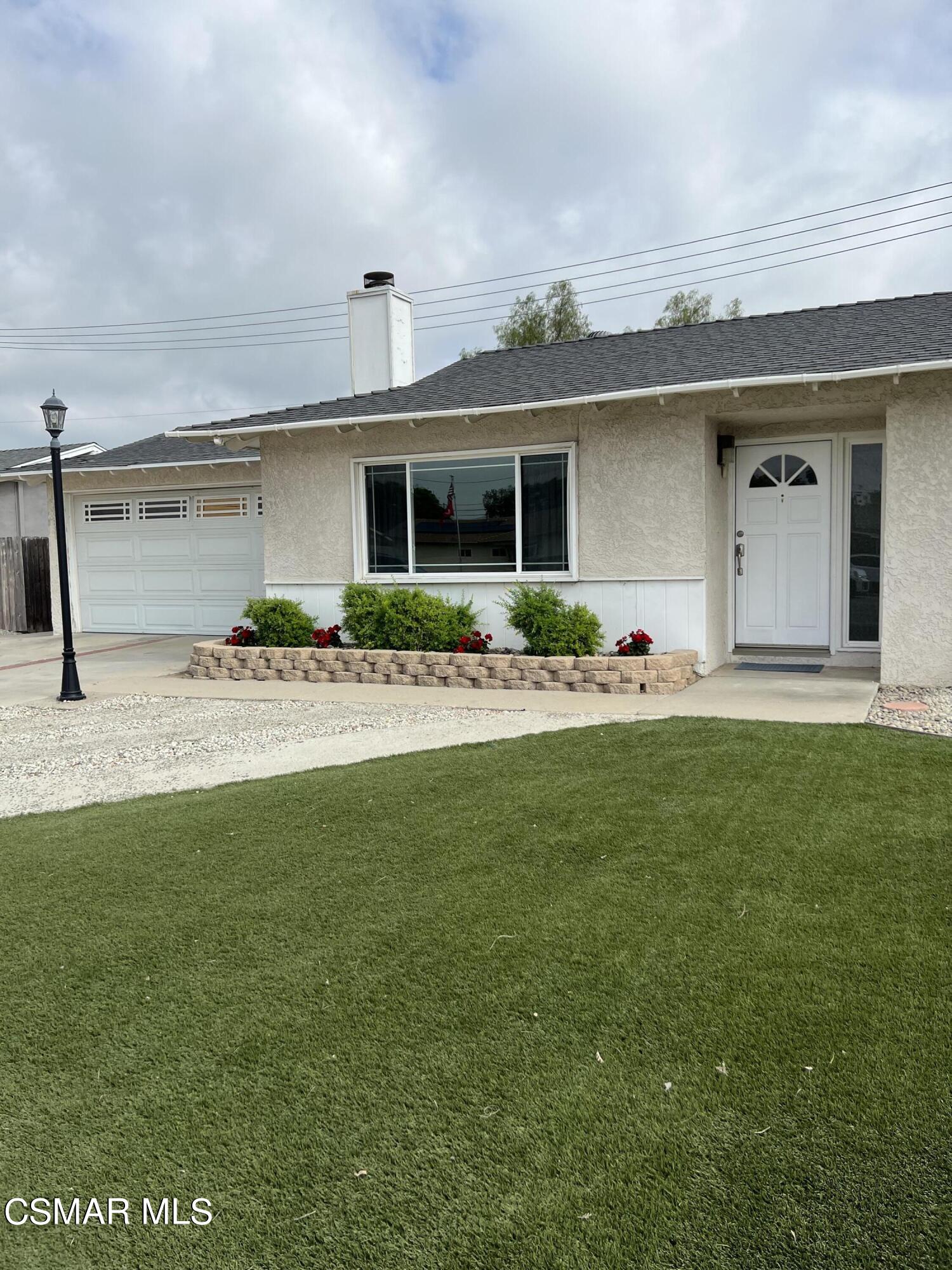 3546 Royal Avenue Simi Valley, CA 93063 - Photo 2 of 26 a front view of a house with garden
