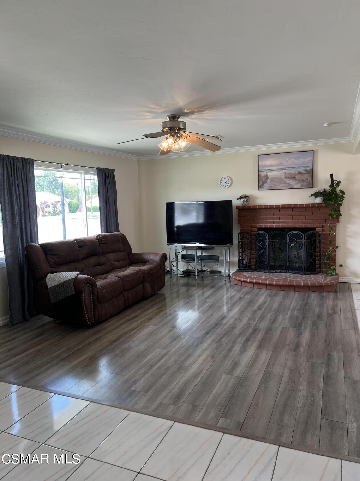 3546 Royal Avenue Simi Valley, CA 93063 - Photo 4 of 26 a living room with furniture and a fireplace
