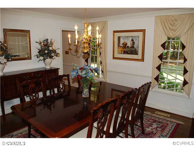 3908 Timber Ridge Place Midlothian, VA 23112 - Photo 4 of 12 a view of a dining room with furniture and chandelier