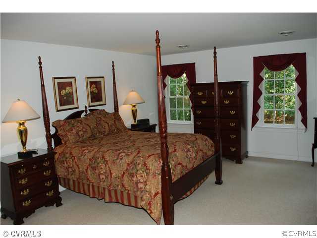 3908 Timber Ridge Place Midlothian, VA 23112 - Photo 6 of 12 a bedroom with a bed and a closet