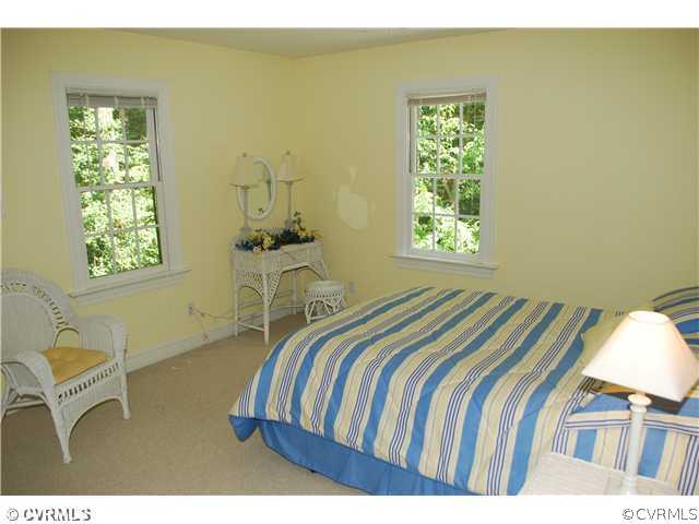 3908 Timber Ridge Place Midlothian, VA 23112 - Photo 10 of 12 a bedroom with a bed and a window