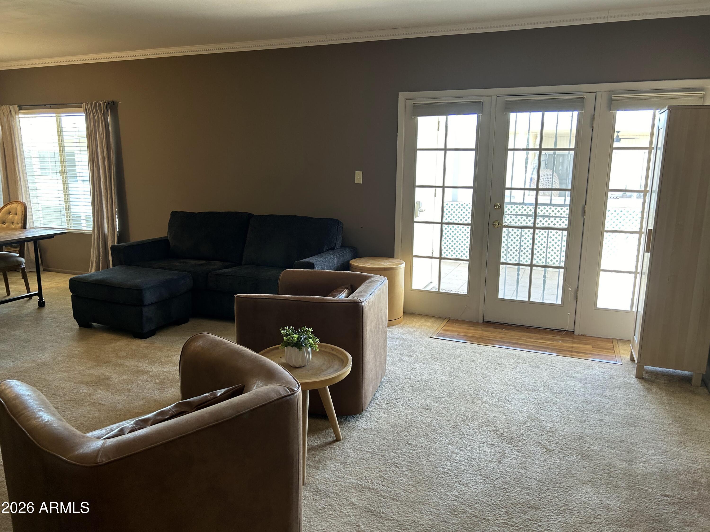 100 West Maryland Avenue, Unit O2 Phoenix, AZ 85013 - Photo 11 of 23 a living room with furniture and a large window