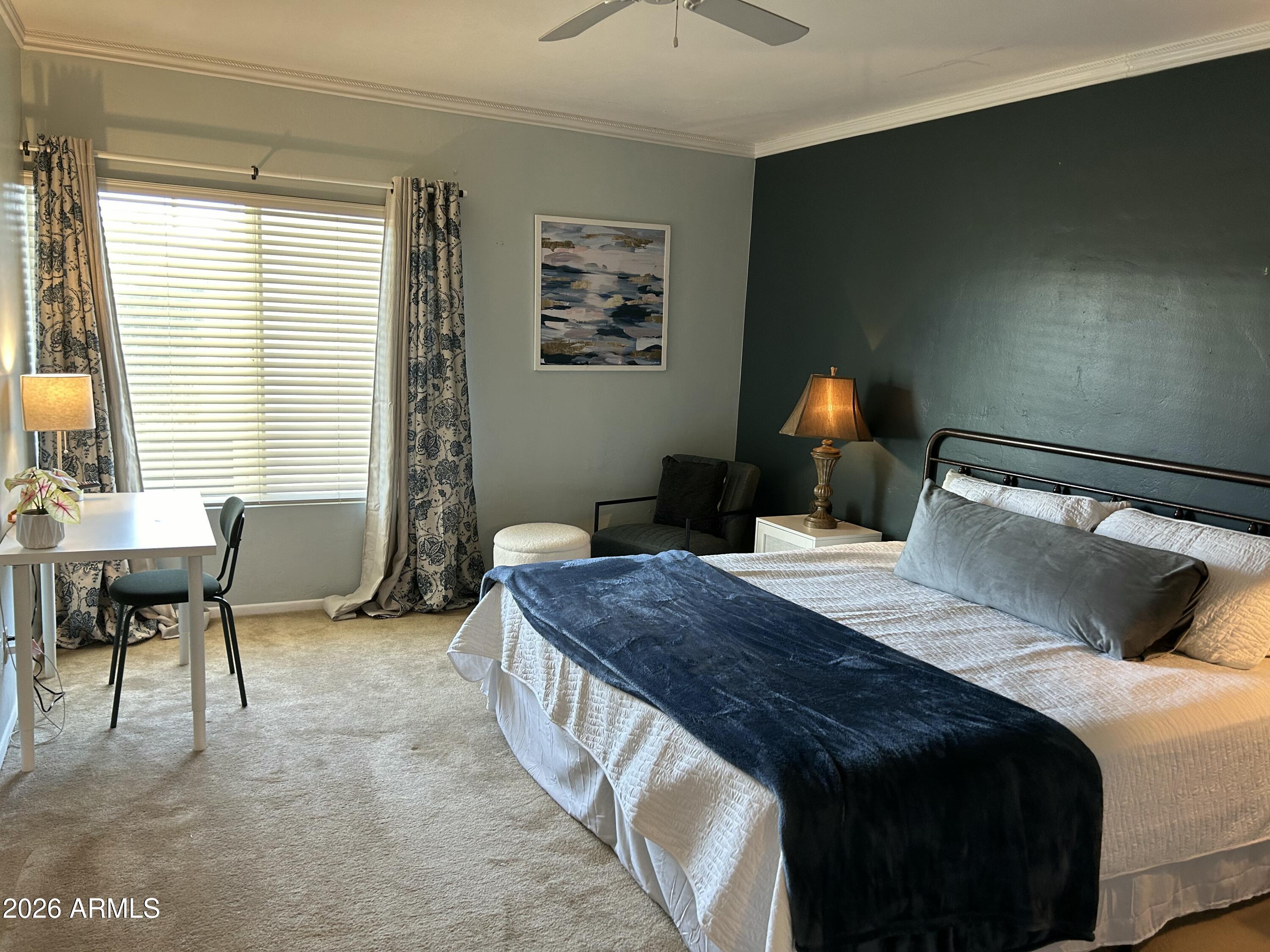 100 West Maryland Avenue, Unit O2 Phoenix, AZ 85013 - Photo 13 of 23 a bedroom with a bed and a window