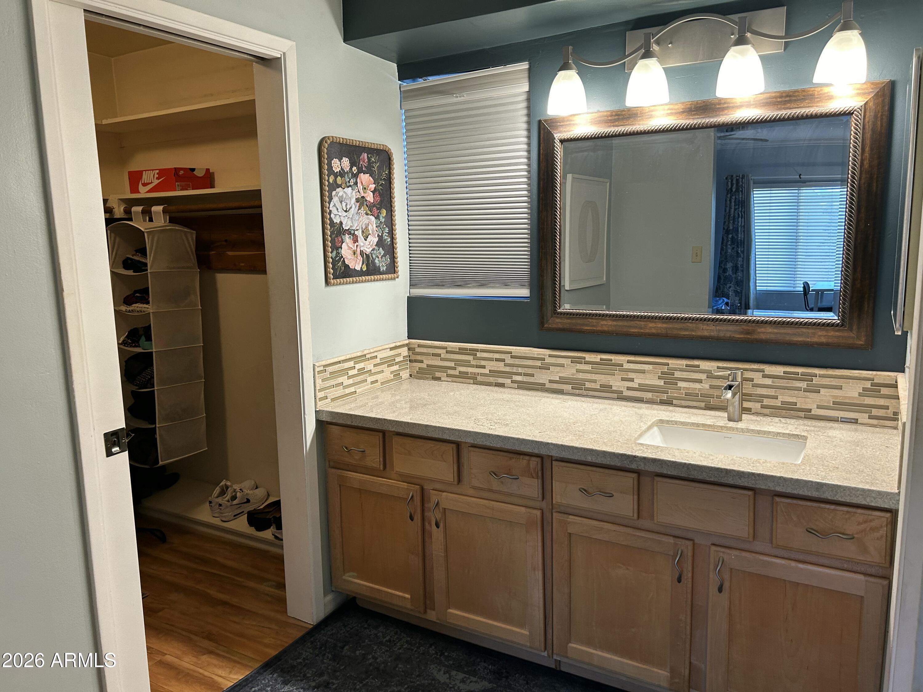 100 West Maryland Avenue, Unit O2 Phoenix, AZ 85013 - Photo 15 of 23 a bathroom with a sink and a mirror