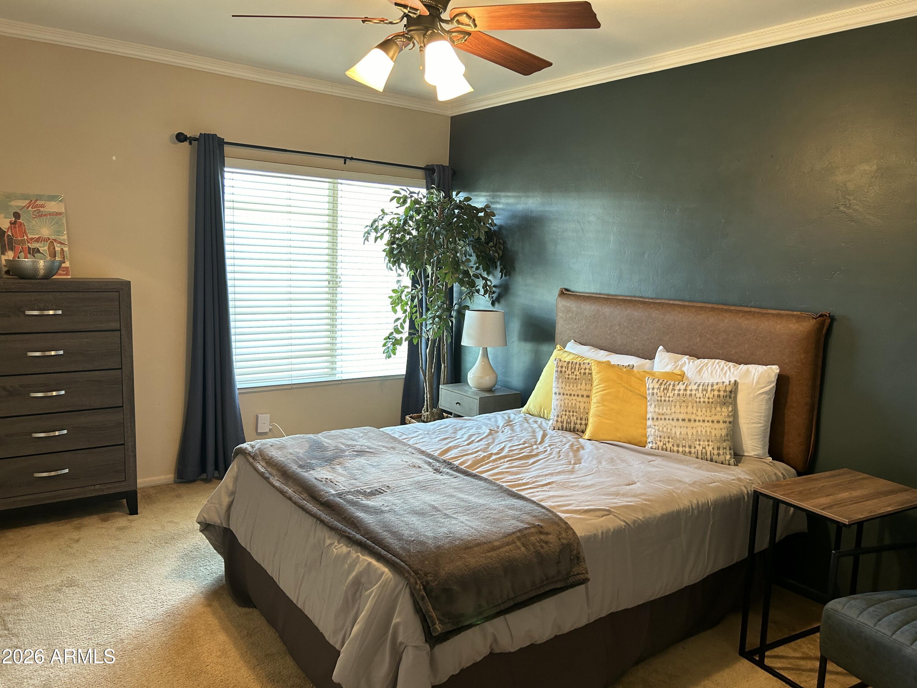 100 West Maryland Avenue, Unit O2 Phoenix, AZ 85013 - Photo 16 of 23 a bedroom with a bed and a chandelier