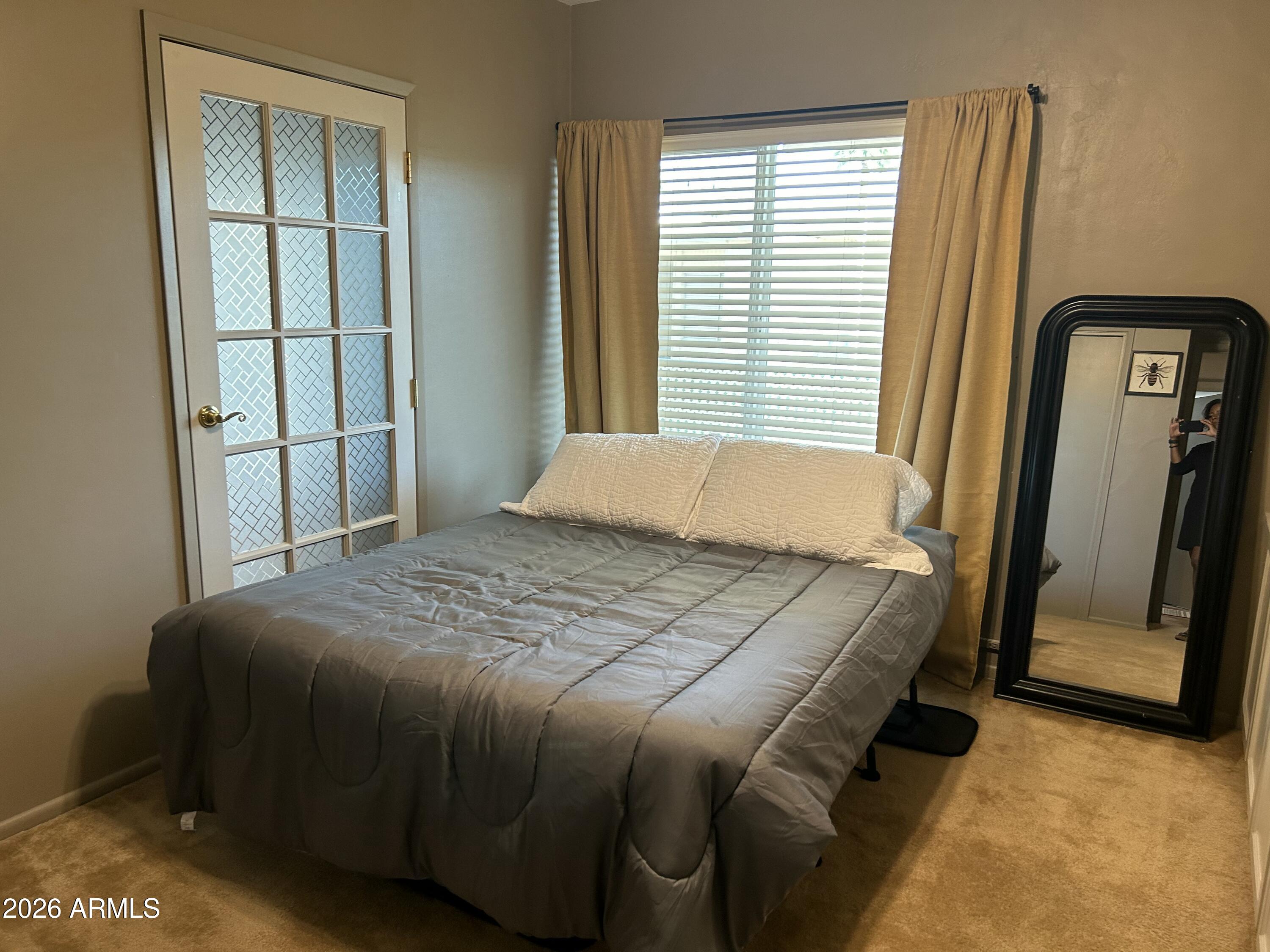 100 West Maryland Avenue, Unit O2 Phoenix, AZ 85013 - Photo 18 of 23 a bedroom with a bed and a window