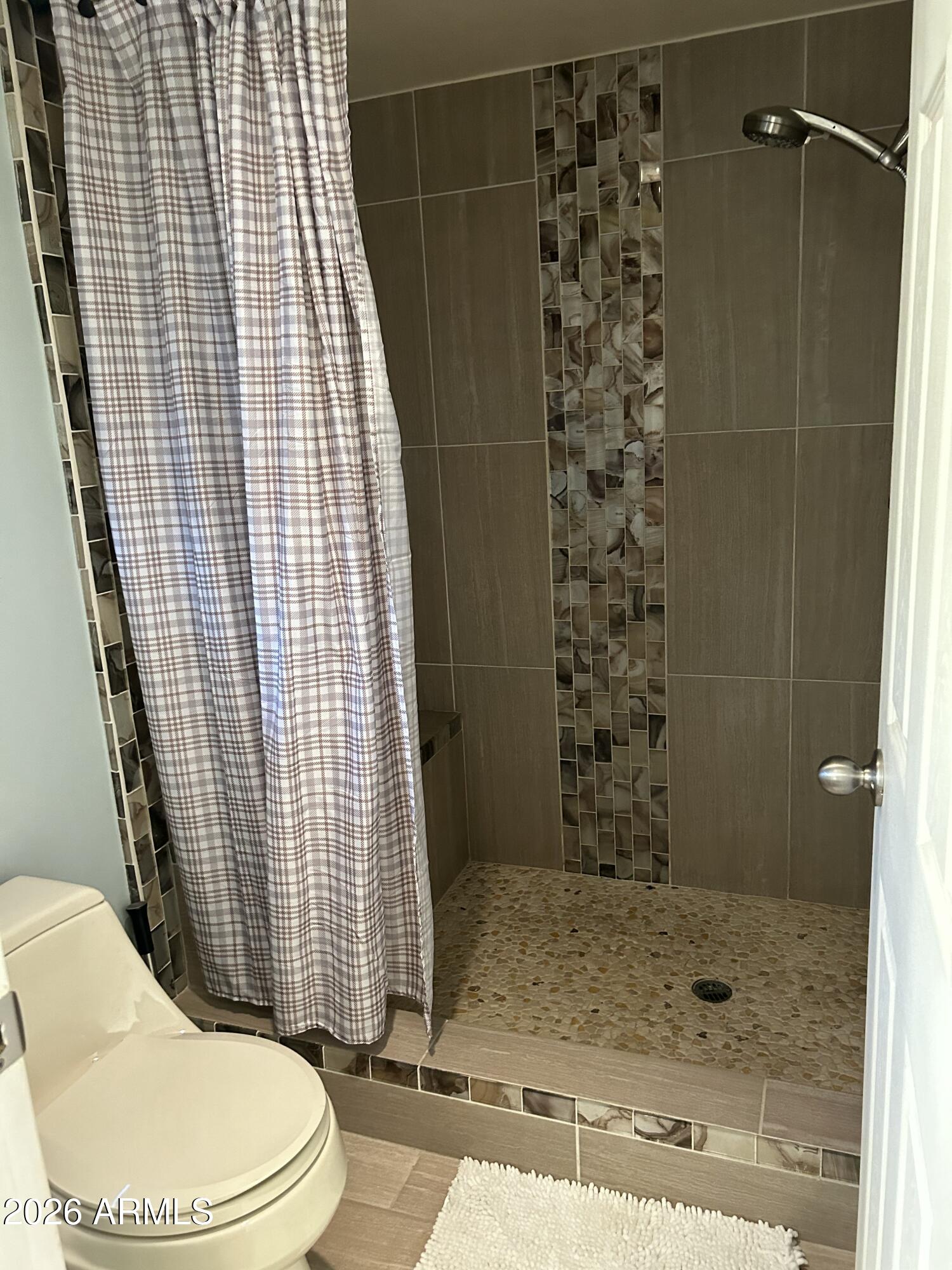 100 West Maryland Avenue, Unit O2 Phoenix, AZ 85013 - Photo 22 of 23 a bathroom with a toilet and shower