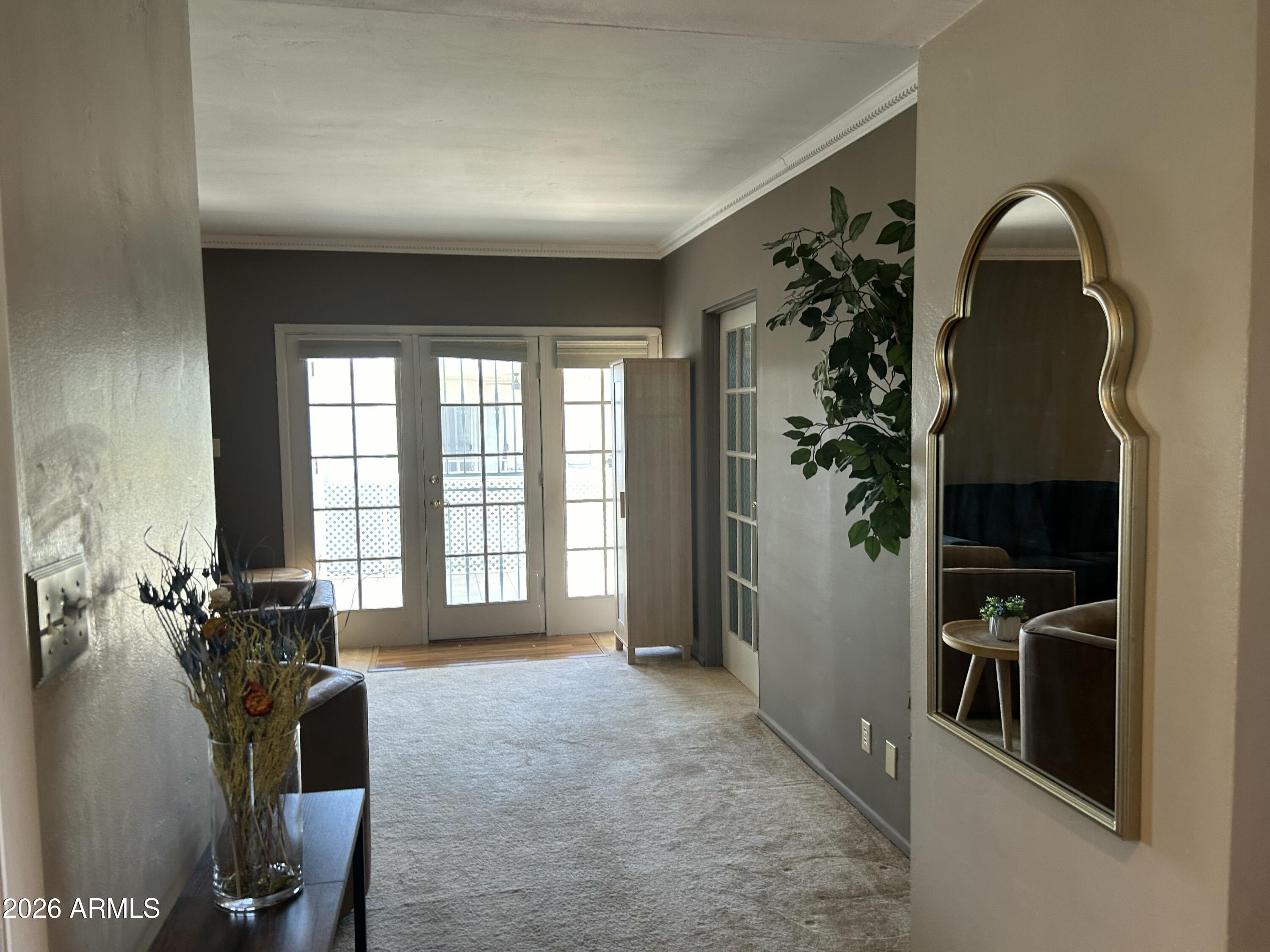 100 West Maryland Avenue, Unit O2 Phoenix, AZ 85013 - Photo 7 of 23 a room with gym equipment and a large window