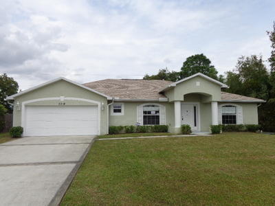 2318 Southeast Merrill Road Port St. Lucie, FL 34952 - Photo 1 of 18 front