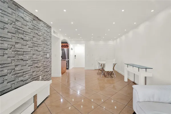 a lobby with furniture and rug