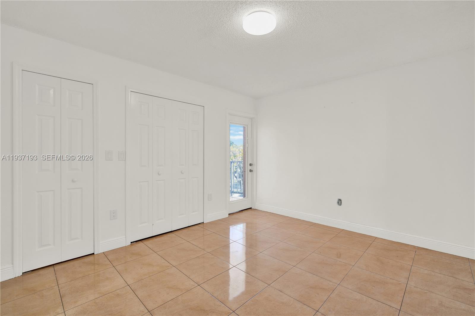 5665 West 20th Avenue, Unit 415 Hialeah, FL 33012 - Photo 15 of 23 a view of an empty room
