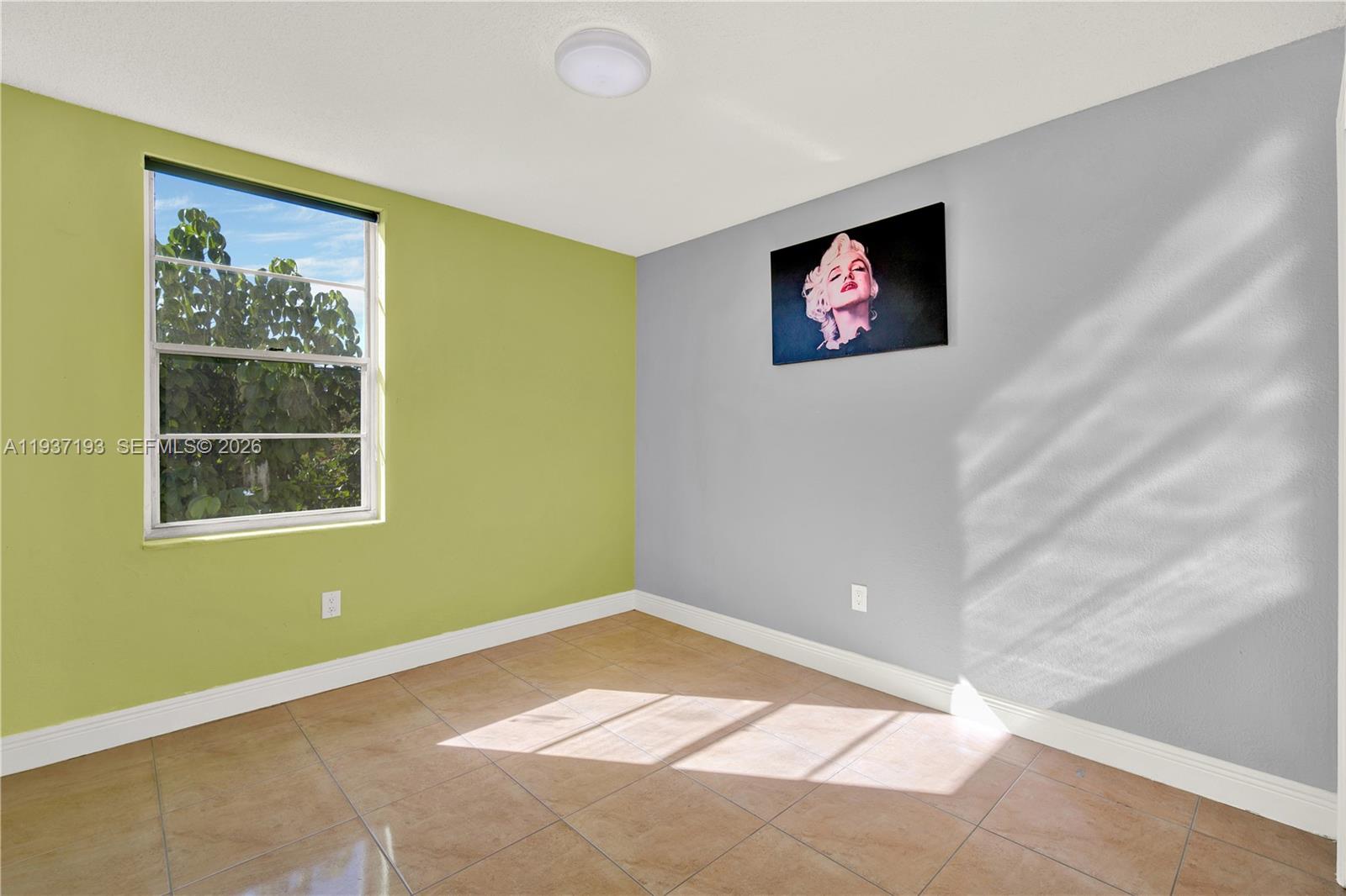 5665 West 20th Avenue, Unit 415 Hialeah, FL 33012 - Photo 16 of 23 a view of a big room with windows and cabinet