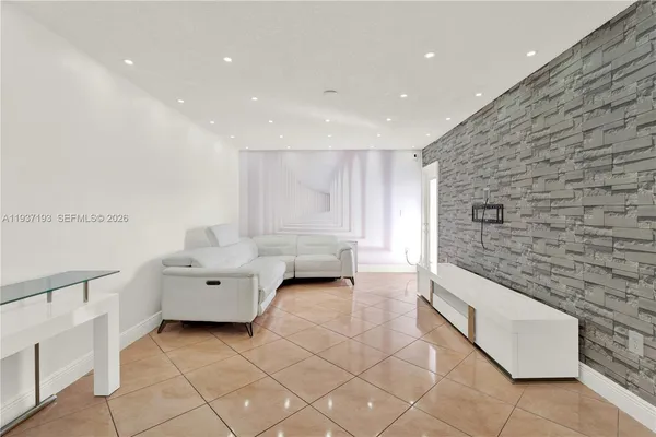 a spacious bathroom with a granite countertop tub sink and mirror