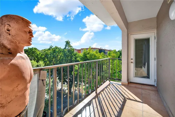 a view of a balcony with wooden floor