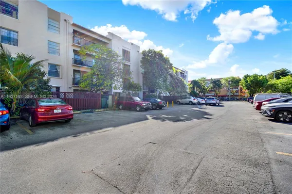 a view of street with parked cars