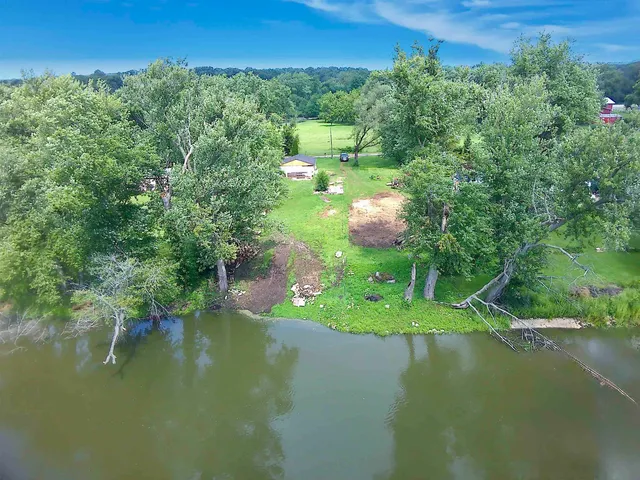 a view of a lake with a yard