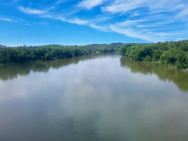a view of a lake with houses in the back