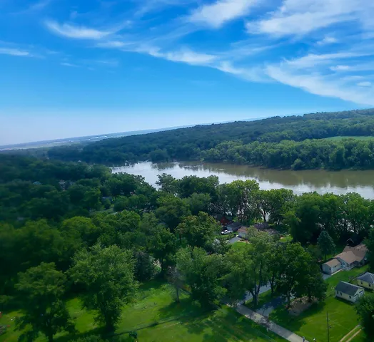 a view of a lake in middle of forest