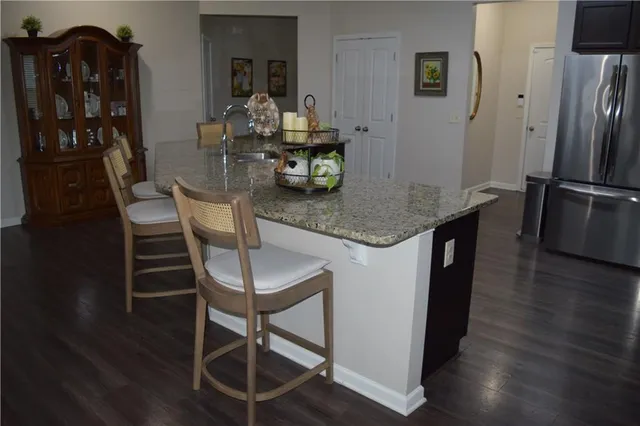 a dining room with furniture and wooden floor