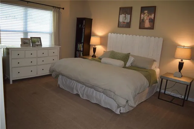 a bed room with a bed and a night stand