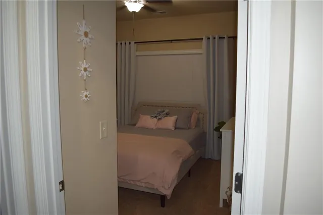 a bedroom with a bed and a mirror