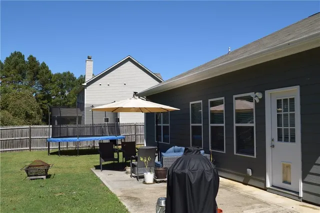 a view of a house with swimming pool and porch