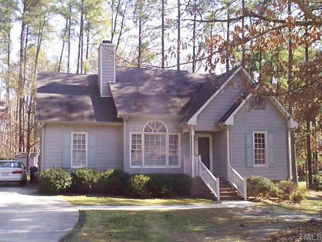 3908 Haithcock Road Raleigh, NC 27604 - Photo 1 of 1 a front view of a house with a yard and garage