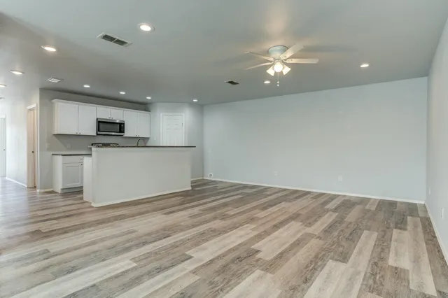a view of a kitchen with a sink and a microwave