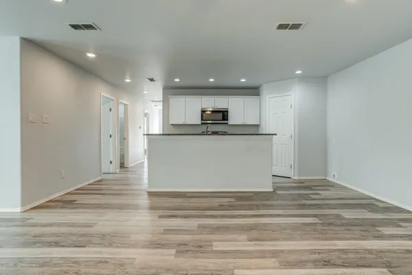 a view of kitchen with wooden floor