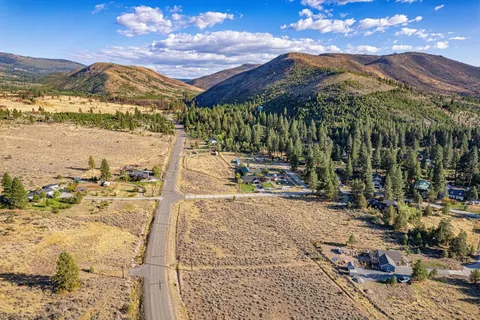 a view of a chairs and table in the patio