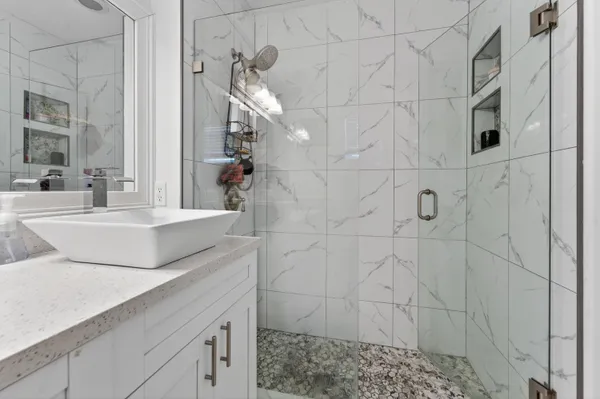 a bathroom with a sink and a mirror