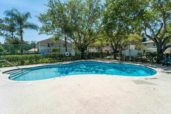 a view of a swimming pool and a yard