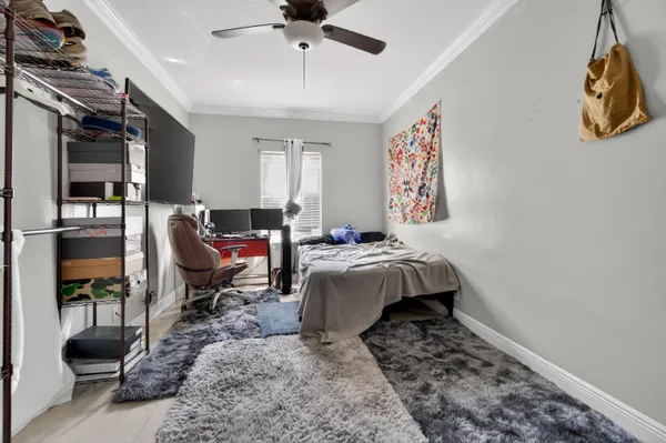 a bedroom with bed and a couch