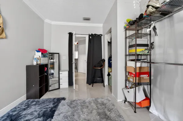 a living room with furniture washer and a flat screen tv