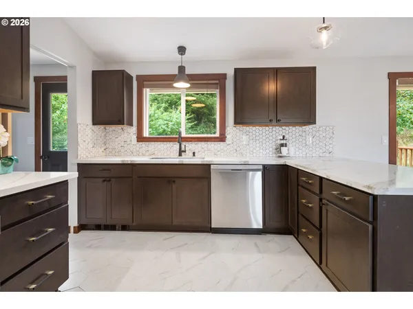 a view of workspace with wooden floor and cabinet