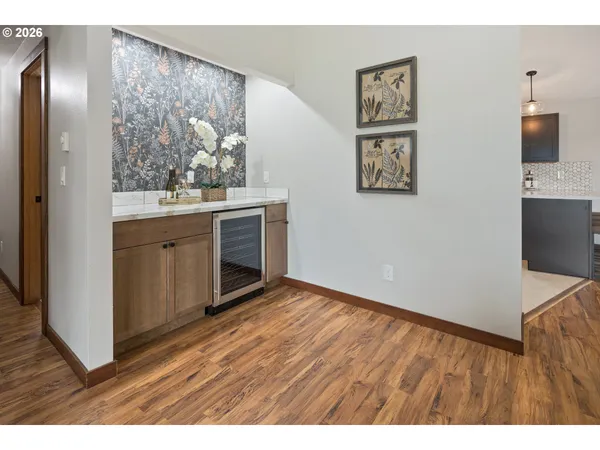 a bathroom with a granite countertop toilet sink and mirror