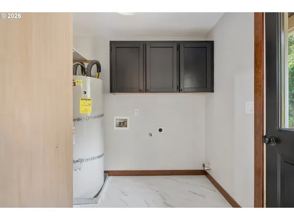 a view of backyard with small cabin