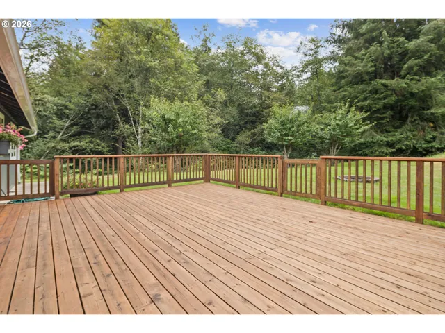 a view of wooden deck and a garden