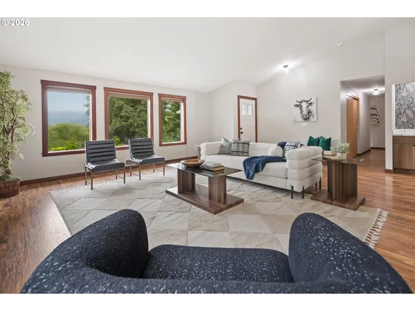 a living room with furniture and a large window