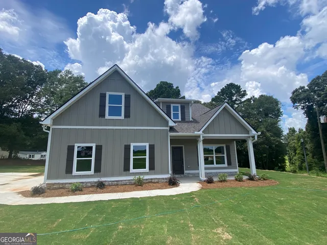 front view of a house with a yard