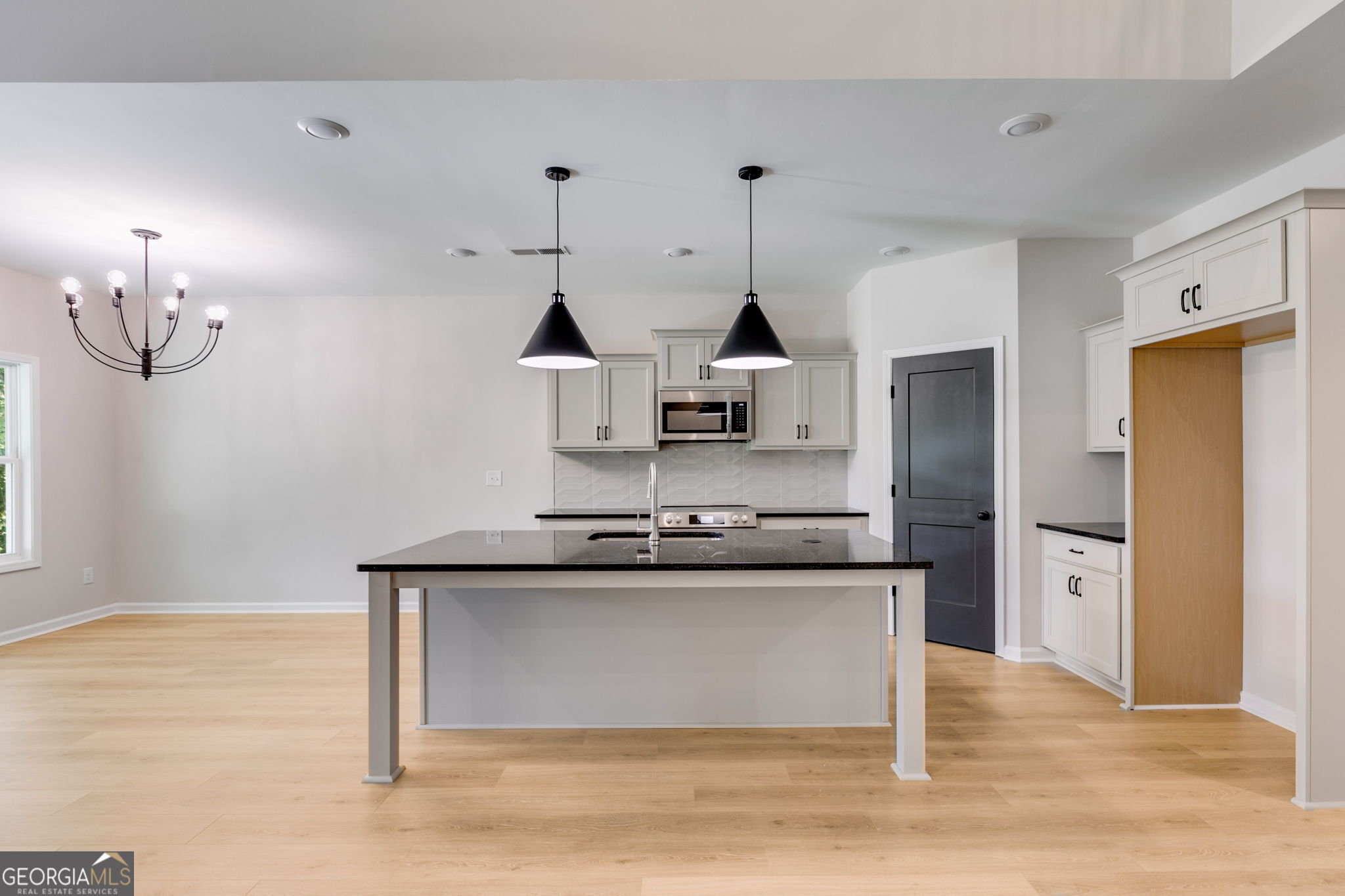 10 Avery Road Roopville, GA 30170 - Photo 14 of 46 a kitchen with stainless steel appliances granite countertop a sink and a refrigerator
